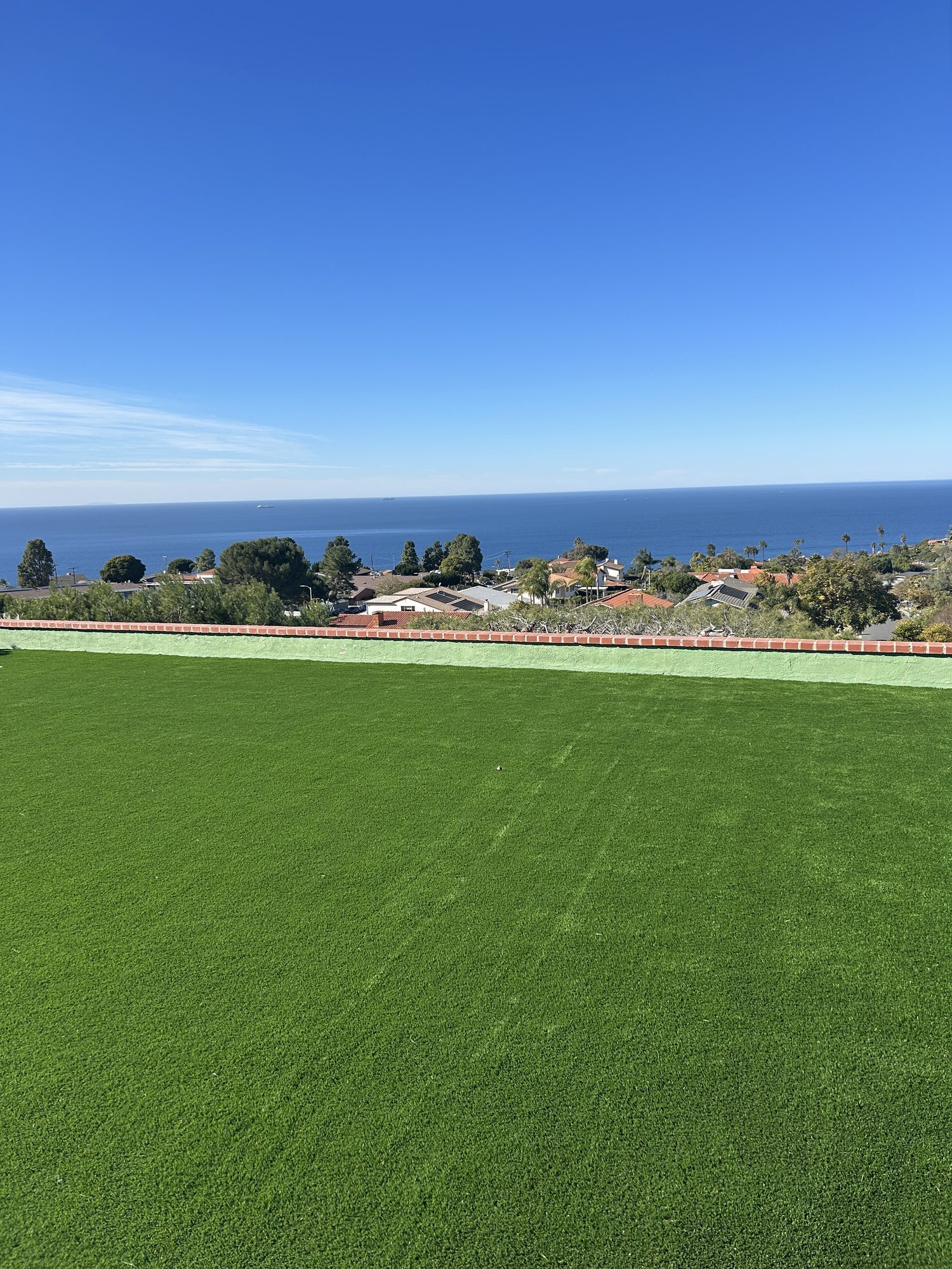 Manicured lawn with a panoramic view of the Pacific Ocean