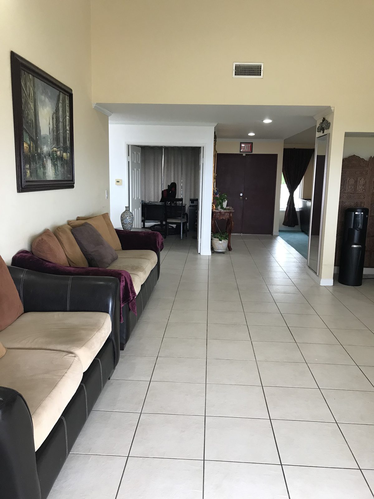 Open common lounge with seating and high ceilings